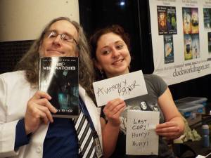 Me and my kid with my last copy of She Who Watches. Wheee!