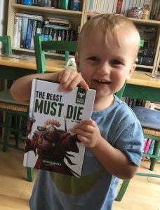 Sammy with a copy of The Beast Must Die