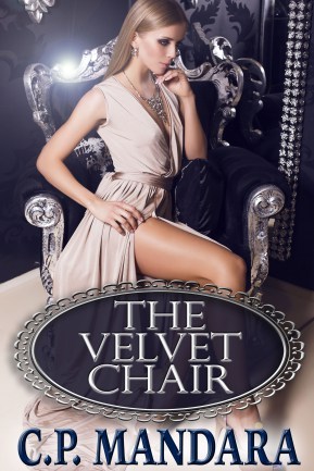 sexy blond in beige silk dress sitting on the black armchair