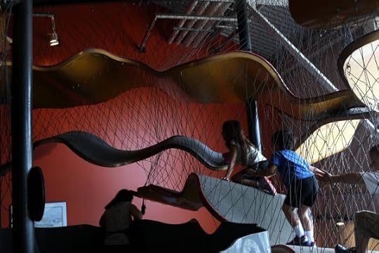 The kids making their way up the awesome climber at the Long Island Children's Museum.