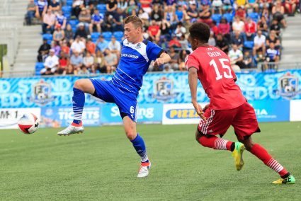 FCE's Nik Ledgerwood battles Ottawa's Dennis Chin for the ball. PHOTO: TONY LEWIS/FC EDMONTON