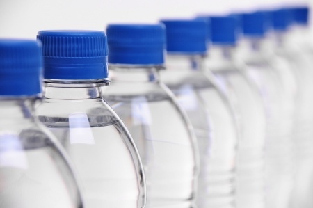14165150 - row of water bottle lids with select focus on second bottle