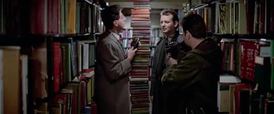 Peter looks at a seven foot tall stack of books skeptically. 