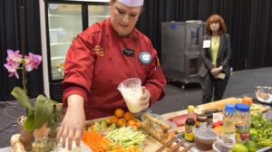 Elizabeth Davis, chef at Hy-Vee, competes in FMI’s Supermarket Chef Showdown. Photo by Steve Greiner.