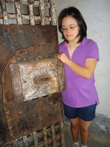 My granddaughter, Tori, checking out one of doors in the jail ...