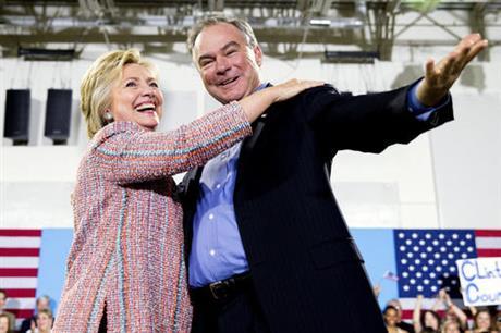 In this July 14, 2016, file photo, Democratic presidential candidate Hillary Clinton, accompanied by Sen. Tim Kaine, D-Va., speaks at a rally at Northern Virginia Community College in Annandale, Va. Clinton has chosen Kaine to be her running mate