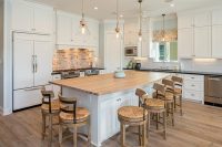 Segreto Secrets - Galveston Beach House - Wood Island and Brick Backsplash in White Kitchen
