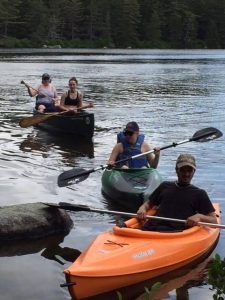 My sister Nicki and her kids Adele, Elise and Tim pull up to shore on Daicey pond. Baxter is a great family getaway.