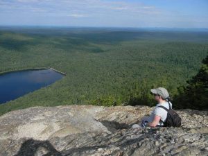 My sister Liz looks out over South Branch Pond from North Traveler Mountain in the northern park of Baxter State Park.