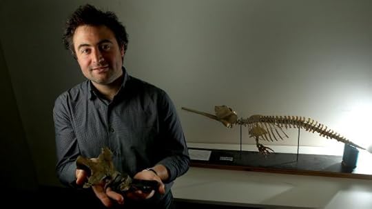 Erich Fitzgerald with one of the dolphin fossils he removed from the Jan Juc rock.