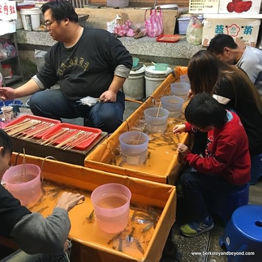 fishing for shrimp at Shilin Night Market in Taipei, Taiwan