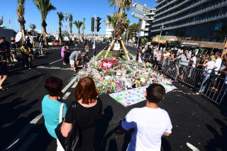 AD213089480People stand in 