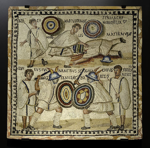 Gladiatorial mosaic from Mérida, Spain. Death of Maternus, killed by Symmachus. 3rd century CE. Photo by Ángel M. Felicísimo, CC BY-SA 2.0 via Wikimedia Commons.