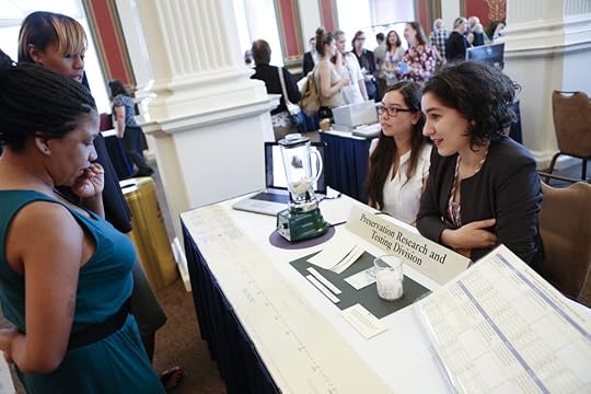 Akari Goda-Maurerzzutt, a Mills College student from San Francisco, and Kalila Morsink of Columbia University from Bethesda, discuss their project on the Preservation and Research Testing Division ASTM 100 Year Paper Aging study. Photo by Shawn Miller.