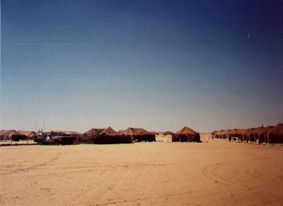 Army tents against the sand
