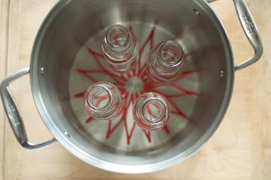 sauce bottles in the canning pot
