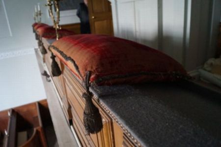 One of the crimson velvet cushions made for the chapel by Thomas Burnett, c.1764. Photo by Jon Stobart. Used with permission.