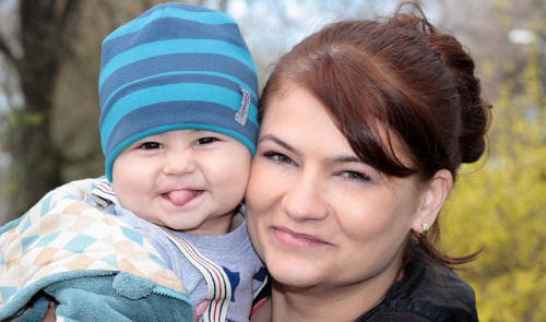 Mom and baby sticking out tongue.