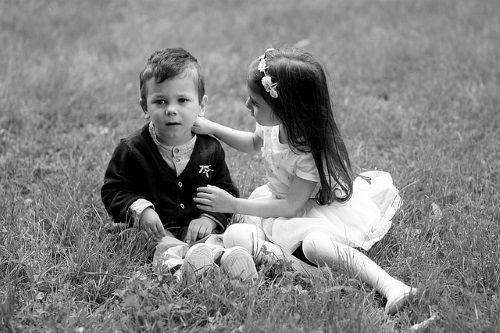 Babies, hand on shoulder.