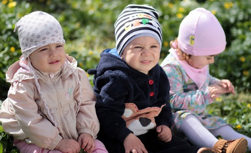 Three babies seated.