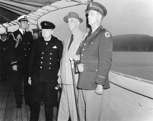 Winston Churchill, Franklin Roosevelt, and Roosevelt's sons Franklin and Elliott aboard USS Augusta off Newfoundland, Aug 1941 (US Naval History and Heritage Command)