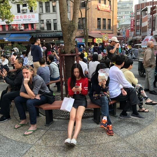 visitors resting on Dihua Street in Taipei, Taiwan
