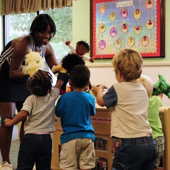 Crestwood High School varsity cheerleading captain MicKayla Ketter plays with toddler class 5-B at Shaw Air Force Base, S.C., Aug. 15, 2012. Ketter and members of her high schoolÕs cheer squad came to teach children about sportsmanship and teamwork.