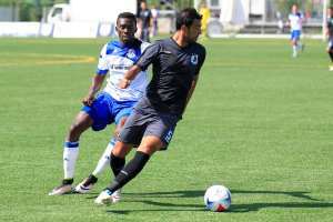 FCE's Tomi Ameobi challenges Minnesota's Tiago Calvano for the ball. PHOTO: TONY LEWIS/FC EDMONTON