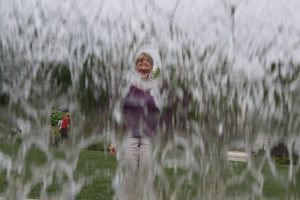 Lucky shot of Beth through the waterfall at the botanical garden.