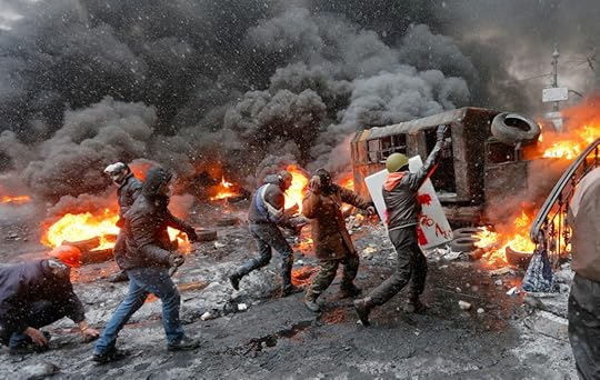 Protesters clash with police in central Kiev, Ukraine, Wednesday, Jan. 22, 2014. Three people have died in clashes between protesters and police in the Ukrainian capital Wednesday, according to medics on the site, in a development that will likely escalate Ukraine's two month-long political crisis. The mass protests in the capital of Kiev erupted after Ukrainian President Viktor Yanukovych spurned a pact with the European Union in favor of close ties with Russia, which offered him a $15 billion bailout. (AP Photo/Efrem Lukatsky)