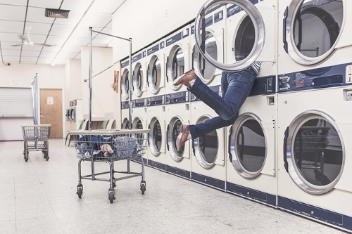 Laundromat, person in dryer