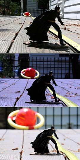 Shots of a couple of toys with different lenses, demonstrating how to make distant background objects look huge.