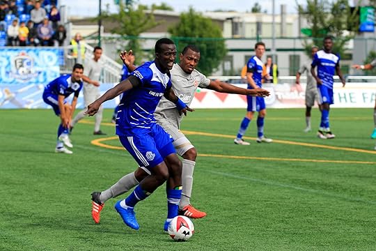 FCE's Pape Diakite battles PRFC's Chris Nurse. PHOTO: TONY LEWIS/FC EDMONTON