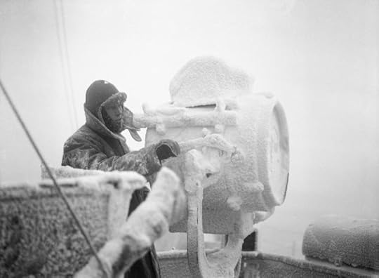 Ice forming on 20-inch signal projector on cruiser HMS Sheffield while she escorts an Arctic convoy to Russia, December 1941 (Imperial War Museum)