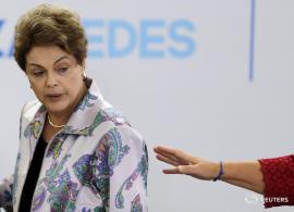 Brazil's President Dilma Rousseff reacts during the launching ceremony of the National Pact to Human Rights Violations on the Internet in Brazil, at the Planalto Palace in Brasilia April 7, 2015. REUTERS/Ueslei Marcelino - RTR4WELL