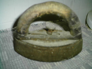 Often called a Sad Iron, this iron was placed on the wood cookstove to heat. The handle comes off and was placed on another iron that was hot. This was one my mother used.