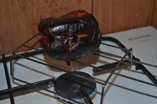 Roast your peppers over a gas flame to turn them from that awful cheery red to a good, proper shade of black.
