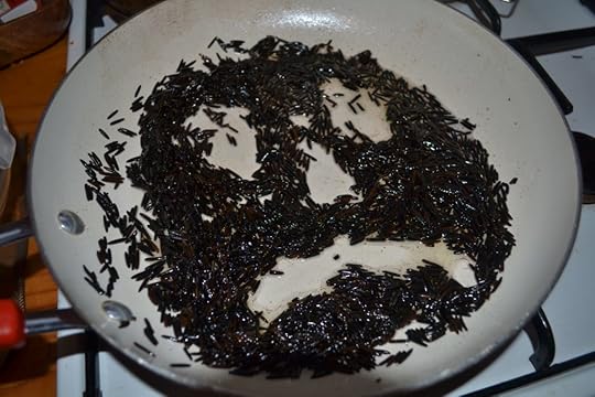 We sometimes divine the future in pans of black rice. This pan told us something sad is going to happen.