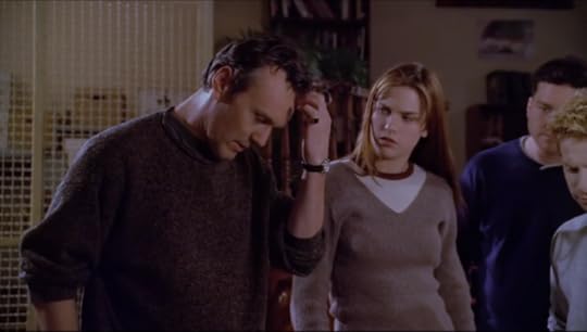 Giles stands with Oz, Larry, and some girl student I've never seen before. Giles looks very tired and frustrated. He's not wearing his tweet suit, either, so you know shit means business. He's got his business sweater on.