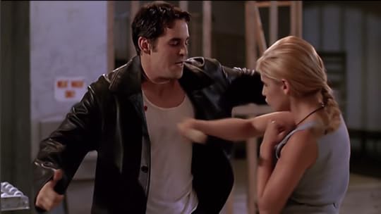 Buffy is driving a stake into Xander's chest.