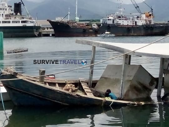 10 Day Palawan Itinerary - Walking Tour of Puerto Princesa (3) - Baywalk Kids playing in boat - Survive Travel