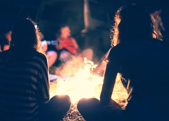 30806961 - people sit at night round a bright bonfire