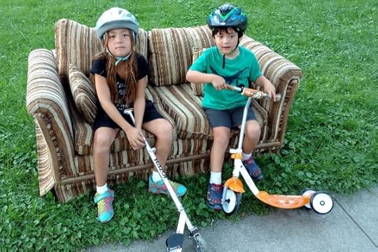 SteelyKid and The Pip taking a break on a scooter walk.