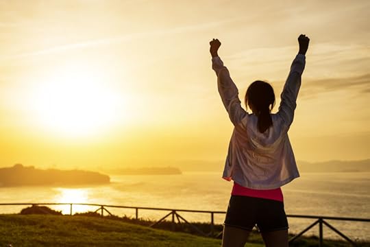 36177363 - successful sporty woman raising arms towards golden beautiful sunset and sea. female athlete celebrating sport success and goals. healthy lifestyle and freedom concept.