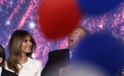 Melania Trump and her husband Donald celebrate with family as balloons fall at the conclusion of the Republican National Convention in Cleveland in July.