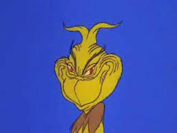 The Grinch, smiling his iconic evil smile.