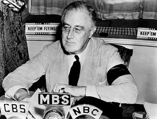 Franklin D. Roosevelt at the White House, delivering radio address, 11 September 1941. Note his black armband for his mother's death four days before (US National Archives)
