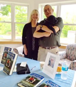 Maine Crime Writer Kate Flora, retired game warden and rookie author Roger Guay, their book 
