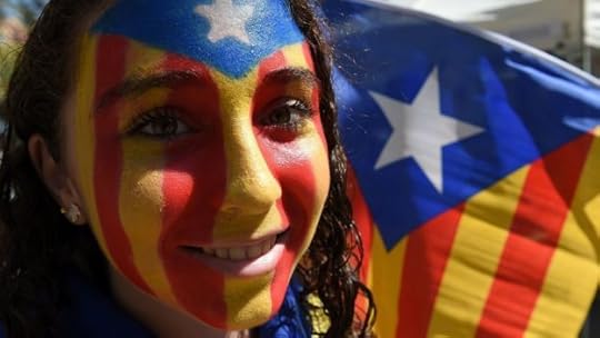 AFP: A Catalan demonstrator with her face painted in the pro-independence colours in Barcelona