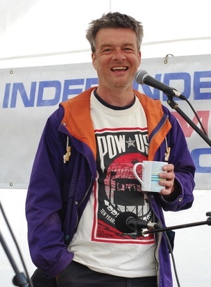 Andy Worthington speaking outside RAF Menwith Hill on July 4, 2013, at an annual protest staged by the Campaign for the Accountability of American Bases (CAAB). 